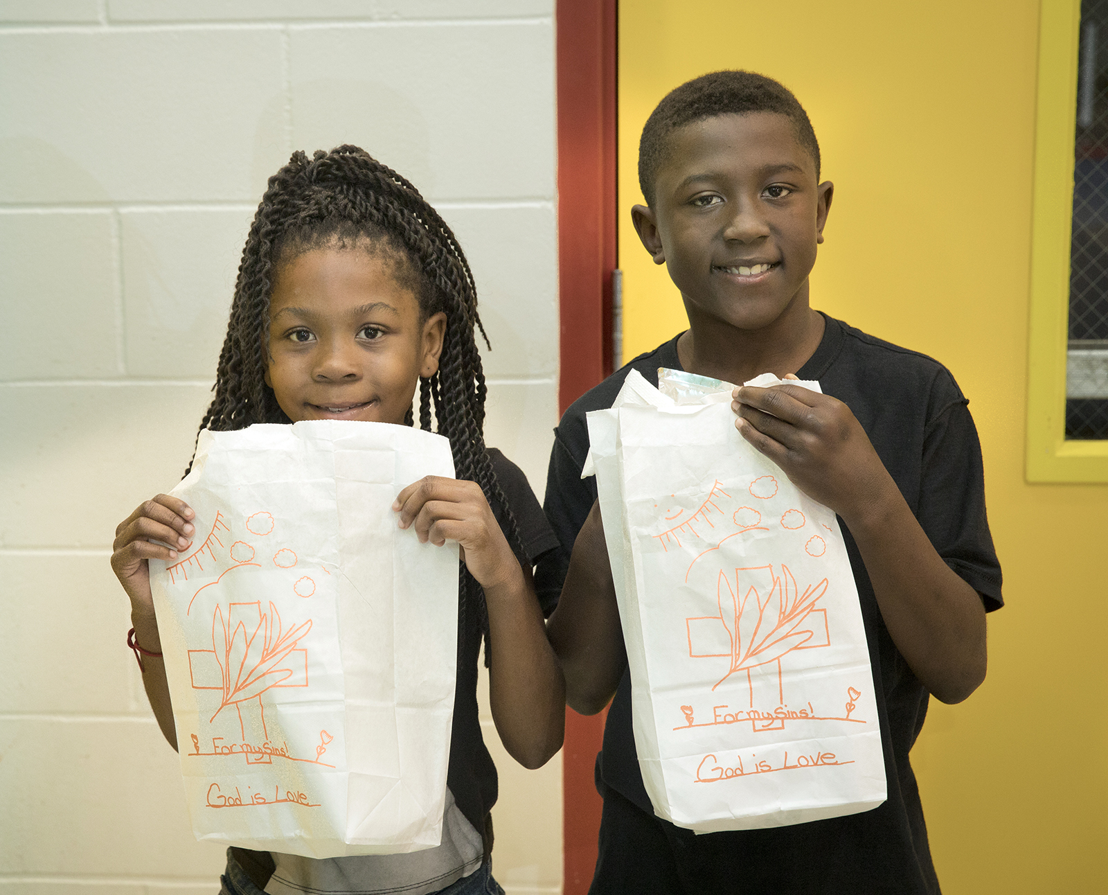 Kids showing off their Easter Bags